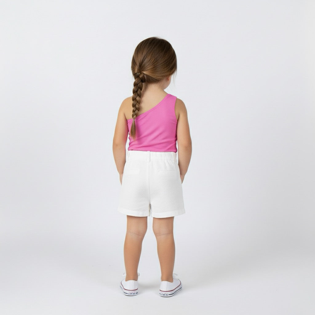 Back view of toddler girl in a hot pink Motch one-shoulder bodysuit and white shorts, showing smooth scoop neckline and fit.