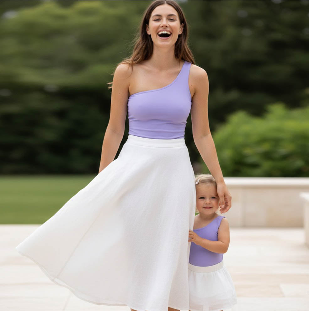 Mom and toddler wearing matching lavender bodysuits by Motch
