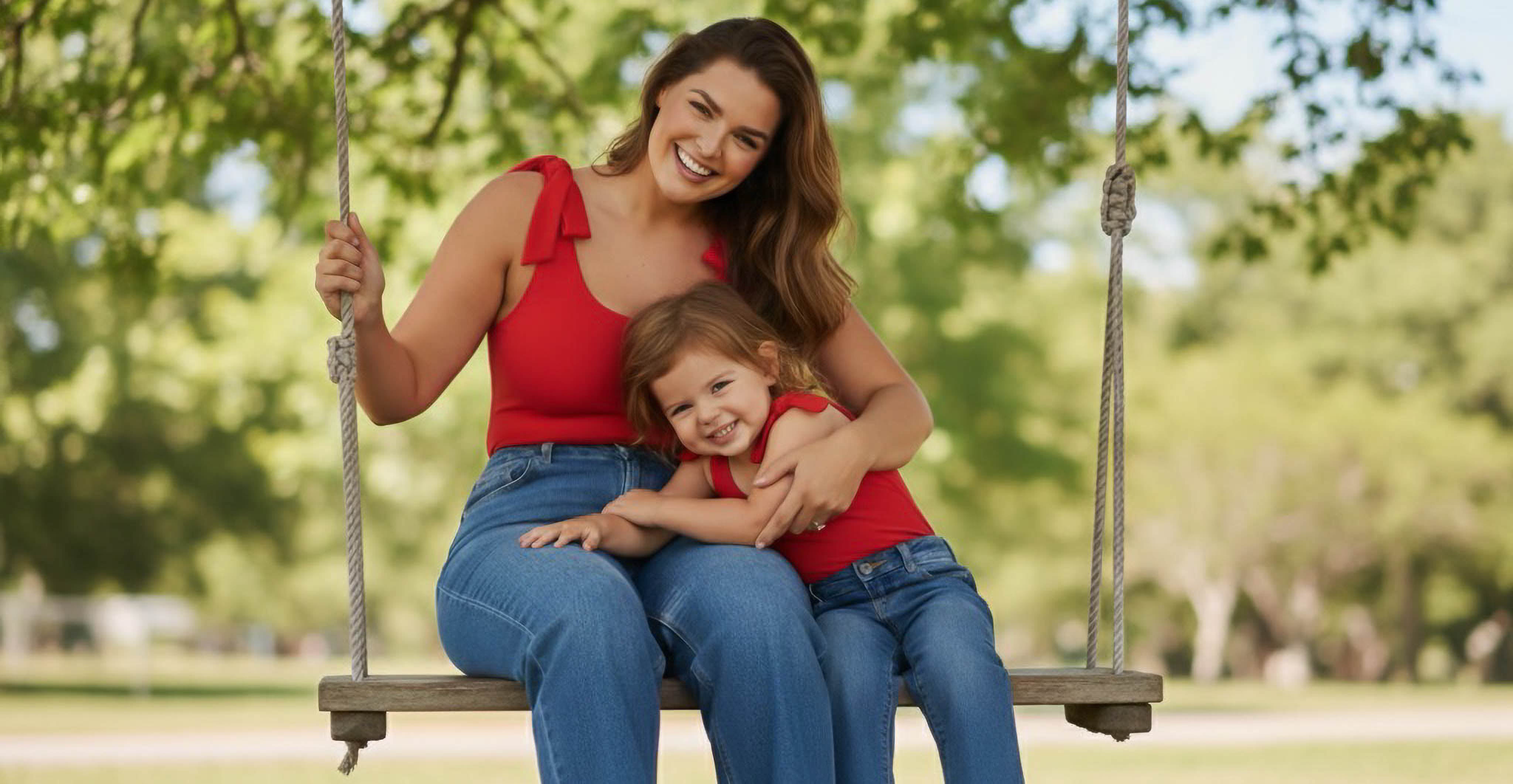 Mom and toddler wearing matching red bodysuits by Motch
